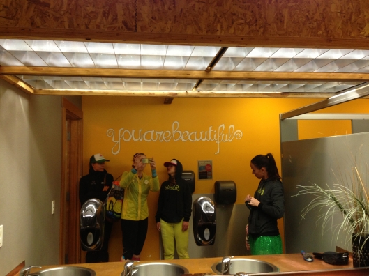 "You are Beautiful" painted backwards on wall so the mirror reflection tells you how it is.
